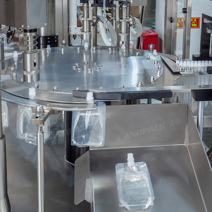 High Speed Double Heads Liquid Spout Pouch Squeeze Pouch Rotary Filling Capping Machine